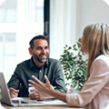 woman in meeting in front of laptop